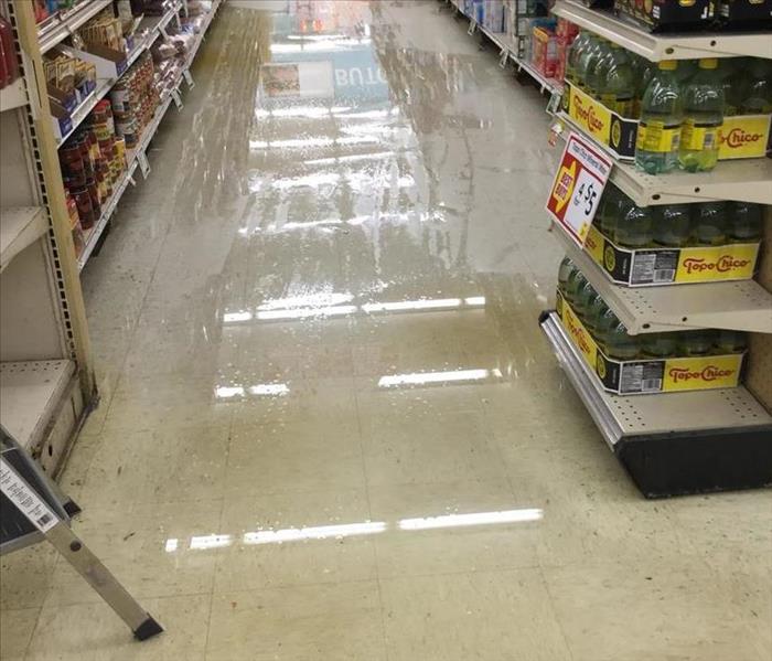 flooded isle at the local grocery store with standing water 